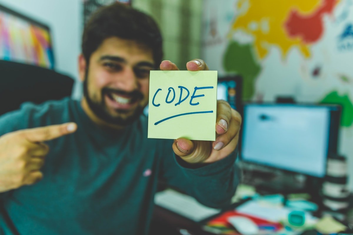 Software engineer taking notes during coding interview preparation session