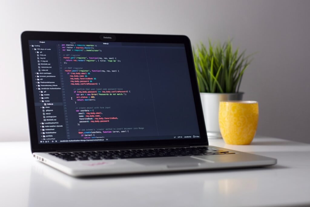 Developer working on system design at a laptop