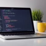 Developer working on system design at a laptop