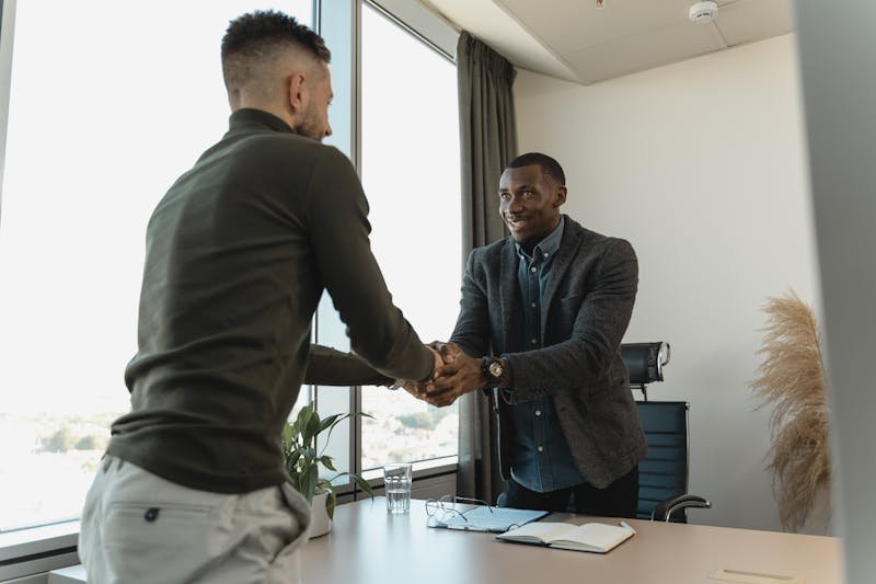 Professional interview setting with candidate discussing technical concepts