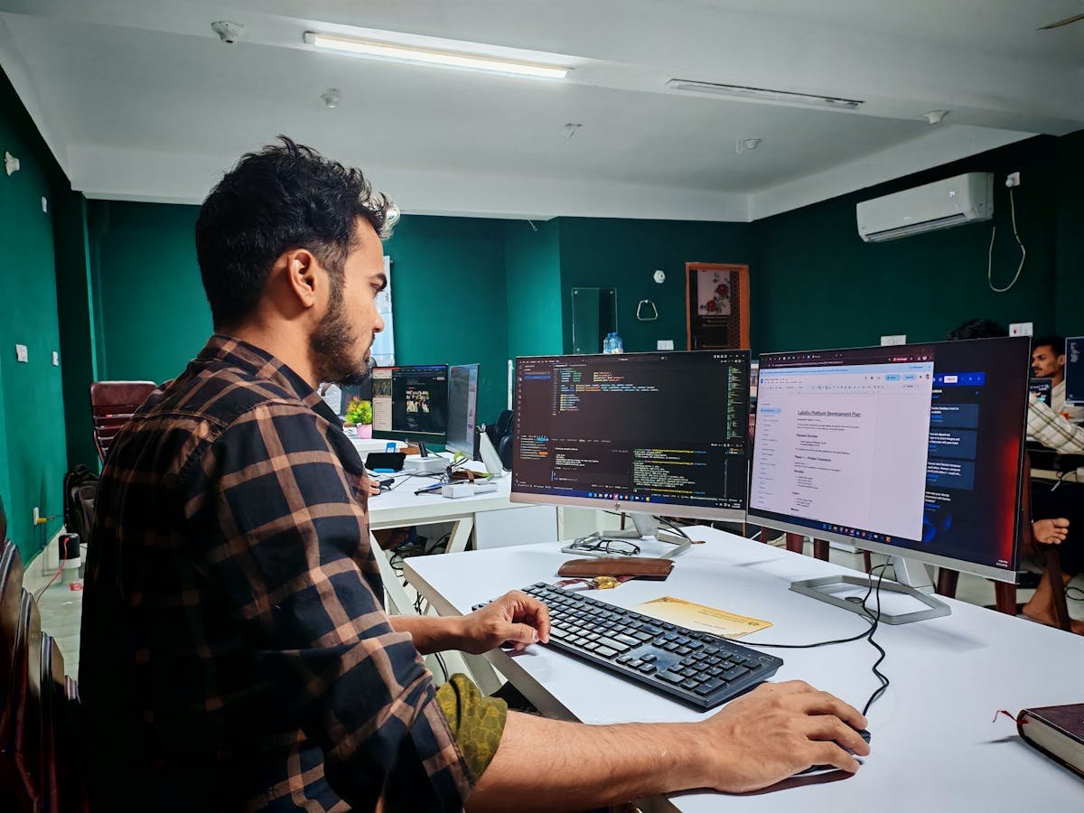 Developer writing code in a modern office