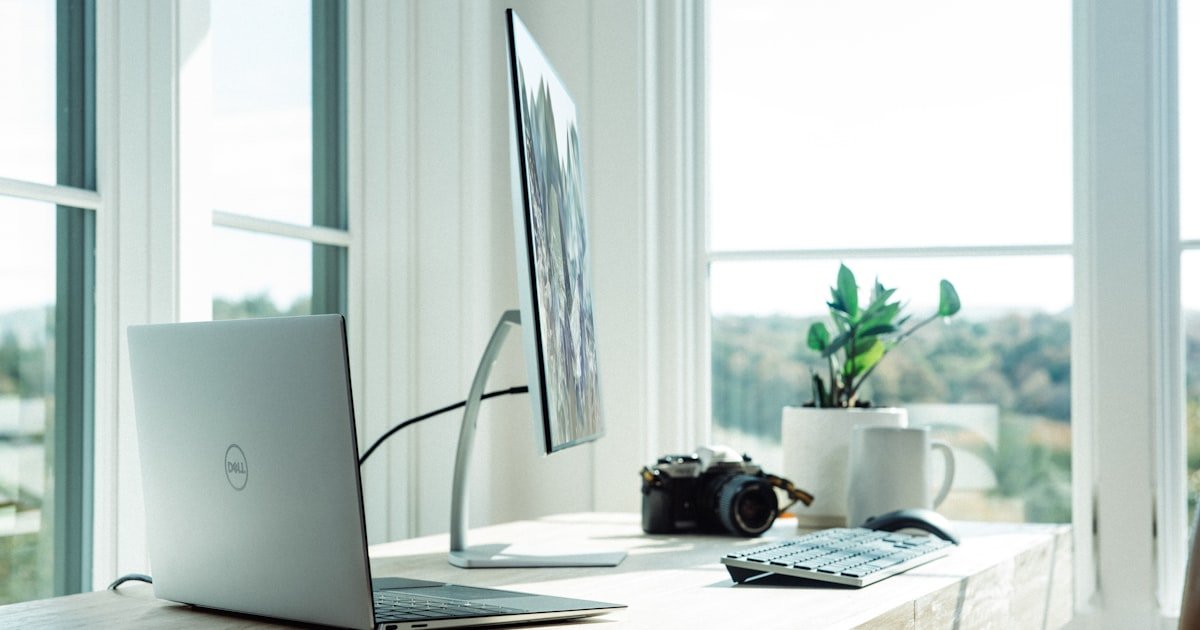 Laptop with external webcam at eye level for video interview