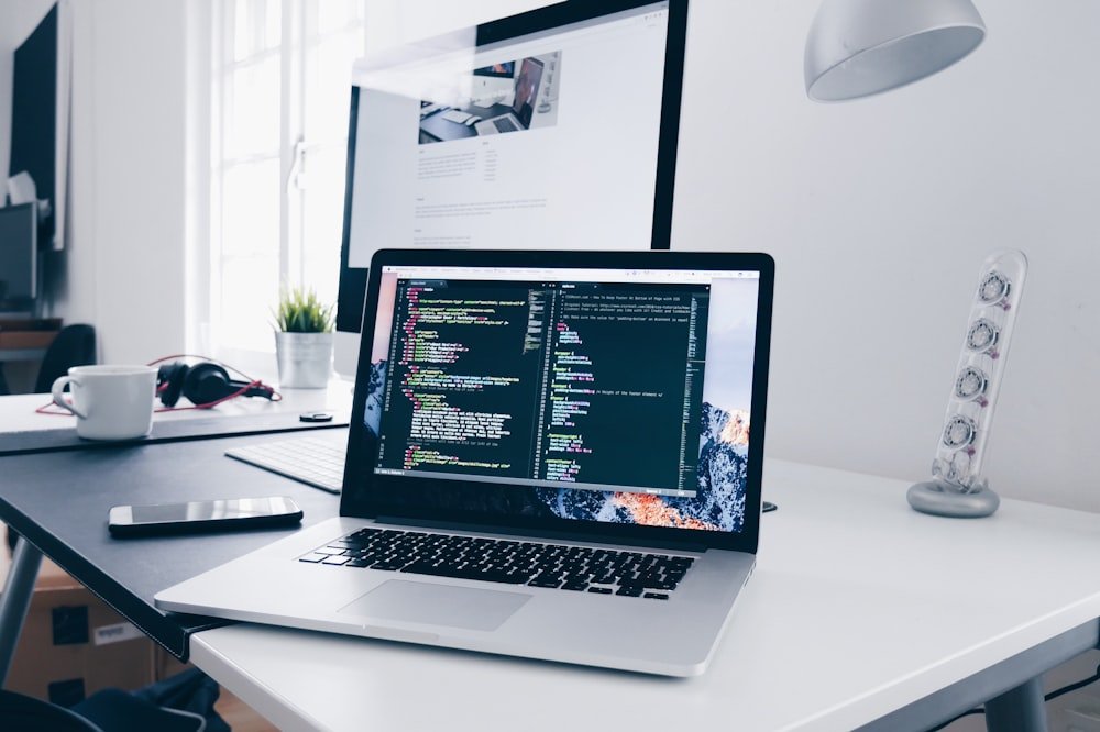Developer writing code on a laptop while practicing algorithms