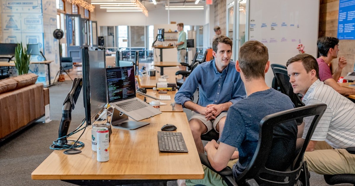 Candidate discussing an offer with a hiring manager in a meeting