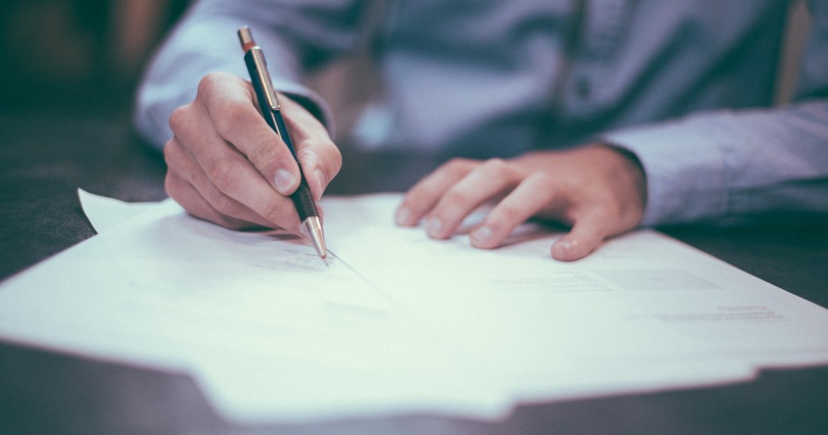 Engineer writing out a salary negotiation plan in a notebook