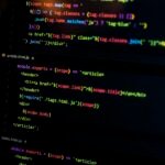 Laptop showing code for solving dynamic programming problems