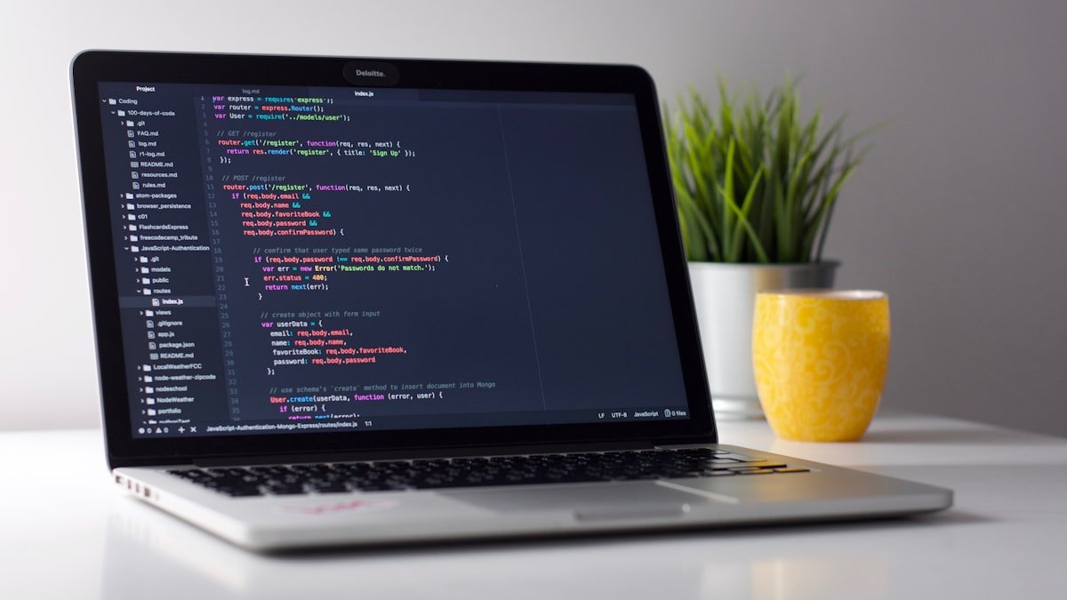 Developer working through a dynamic programming problem on a laptop