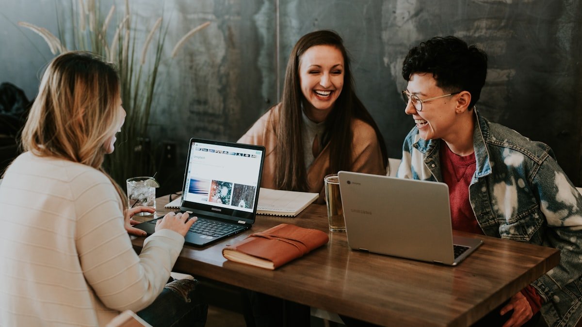 Engineers discussing a job offer at a table