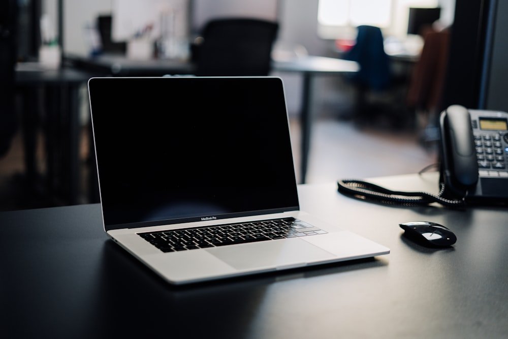 A tidy home office desk set up for a video interview