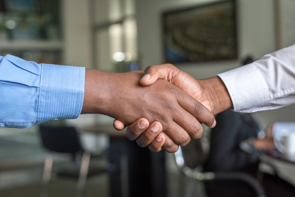 Two professionals shaking hands after an interview