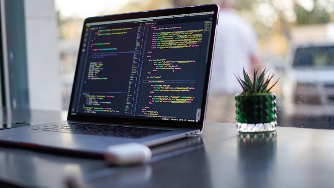 Developer writing Java code on a laptop while practicing two pointers problems