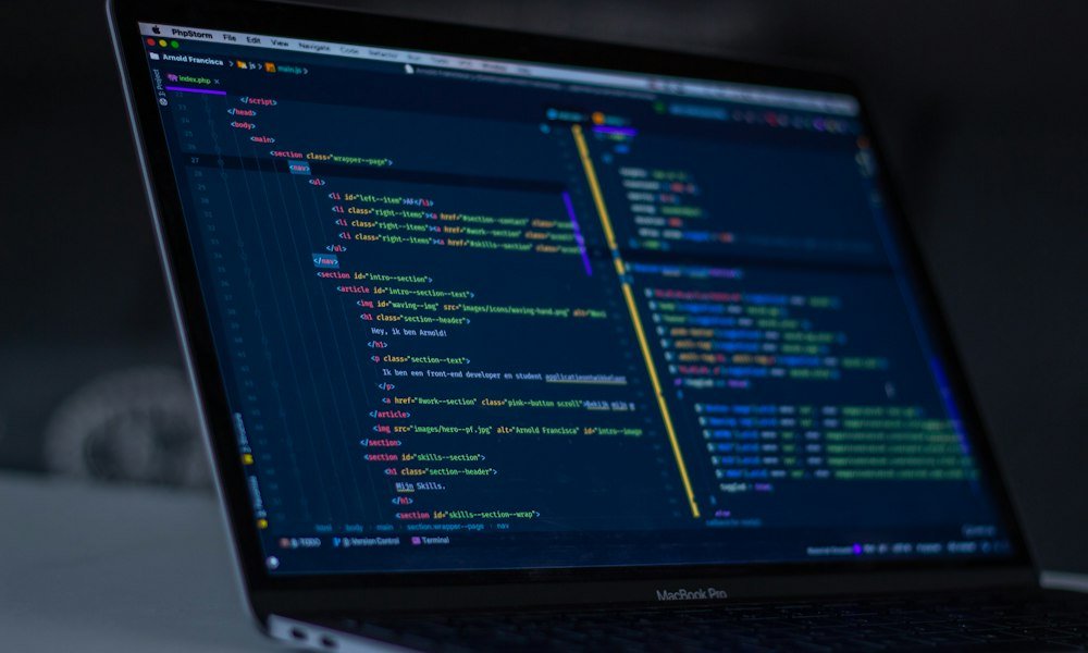Java code on a laptop screen showing object-oriented class design