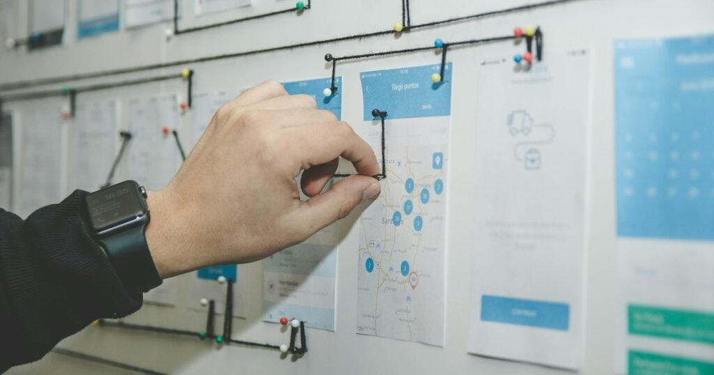Engineers sketching a low-level design on a whiteboard with sticky notes