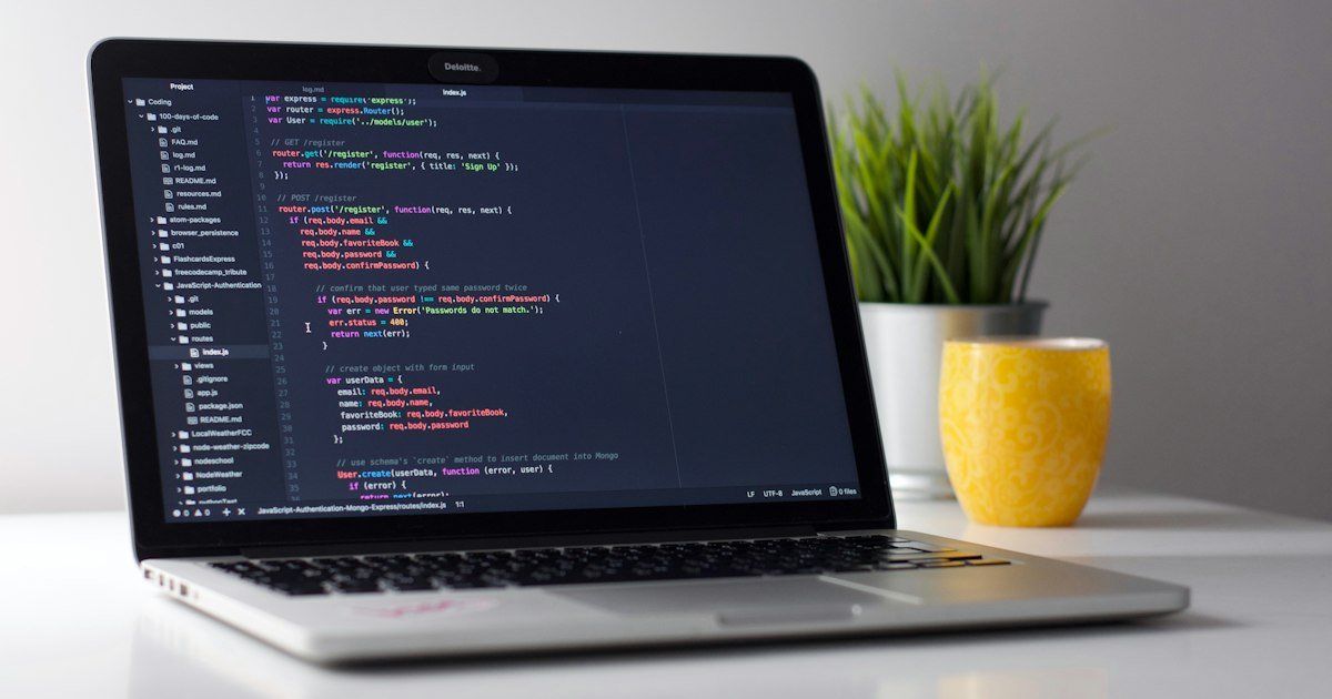 Developer writing algorithm code on a laptop
