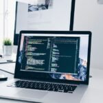 Developer coding on a laptop