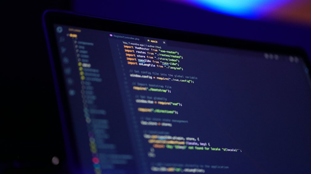Laptop screen displaying colorful code