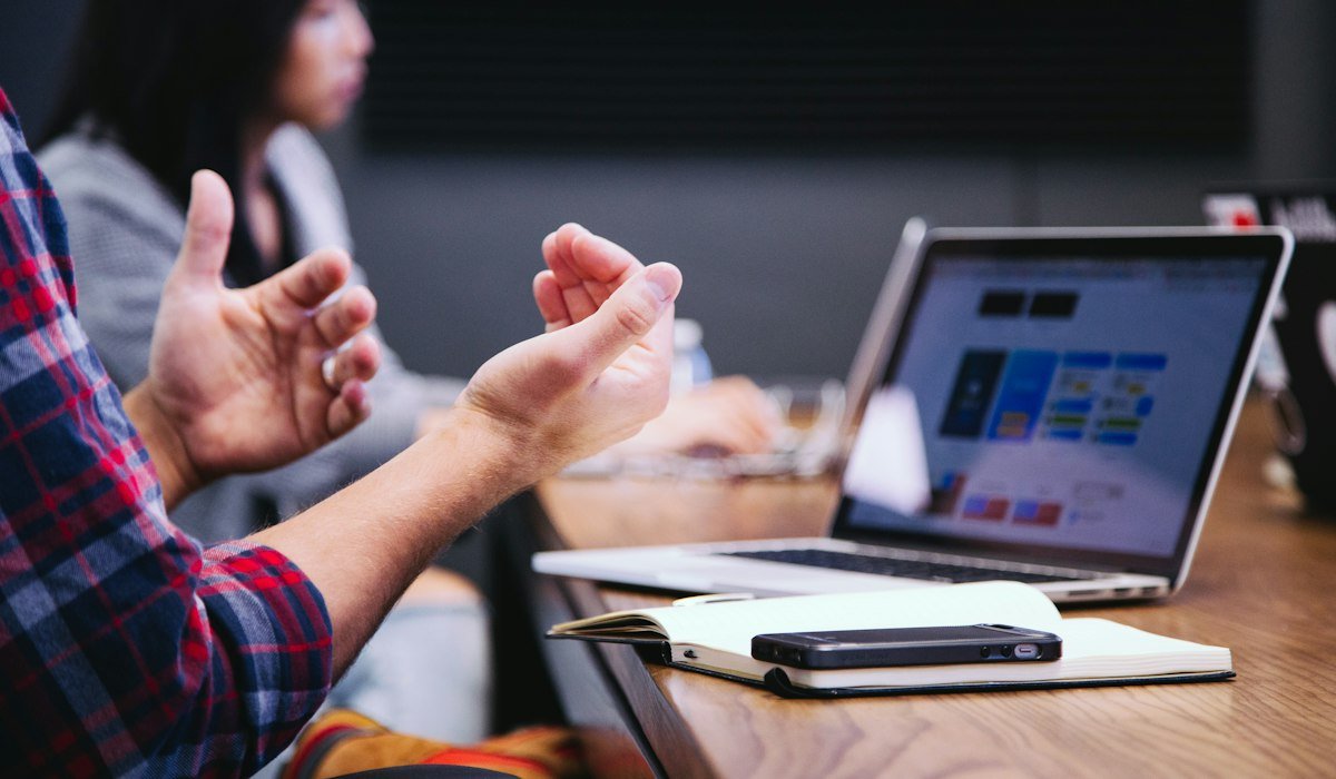 Candidate discussing an offer with a recruiter in a meeting