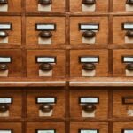 Wooden card catalog drawers representing database indexes and SQL tables